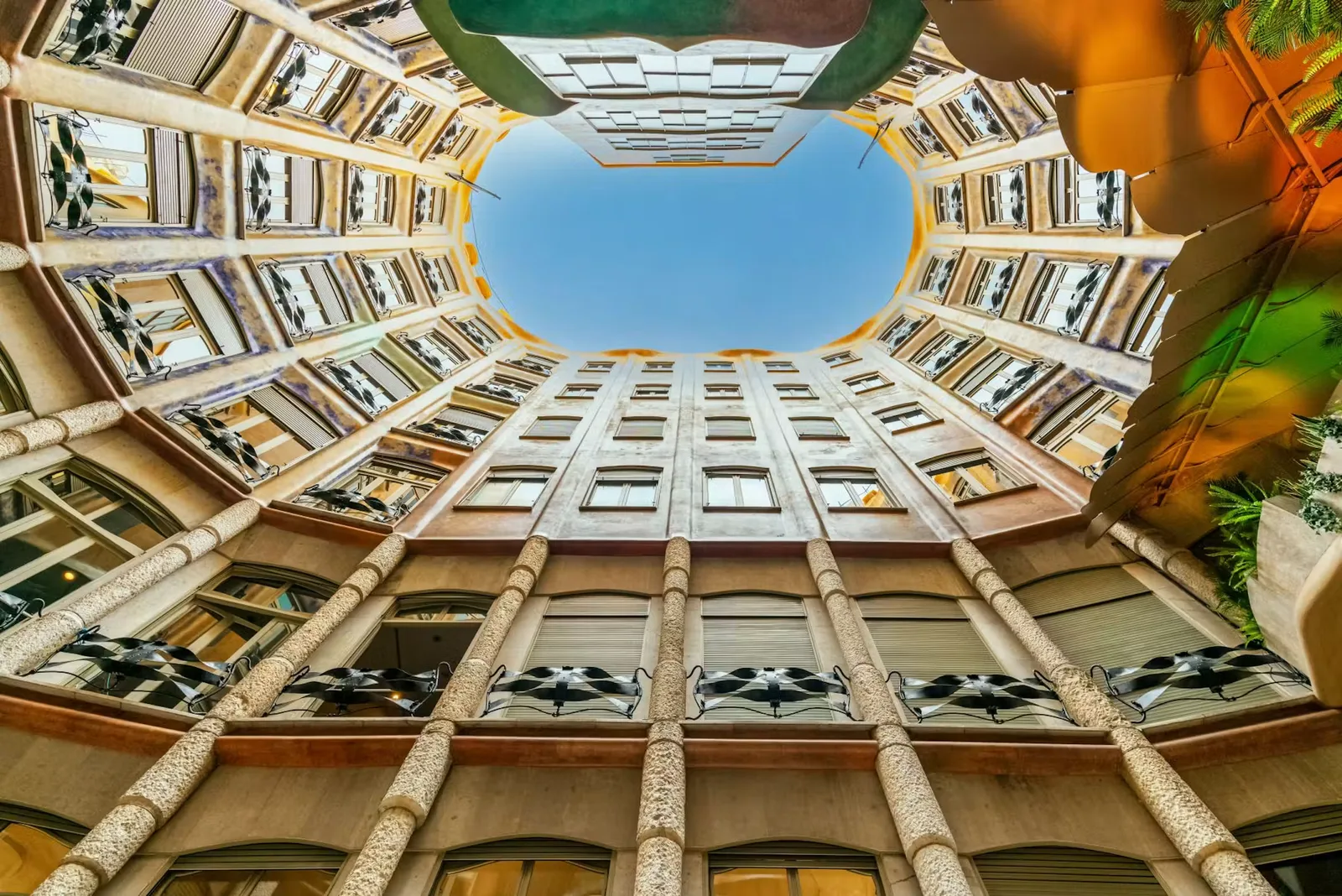 Looking upward through the curving courtyard of Casa Milà